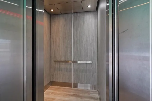 a bathroom with a shower and a sink