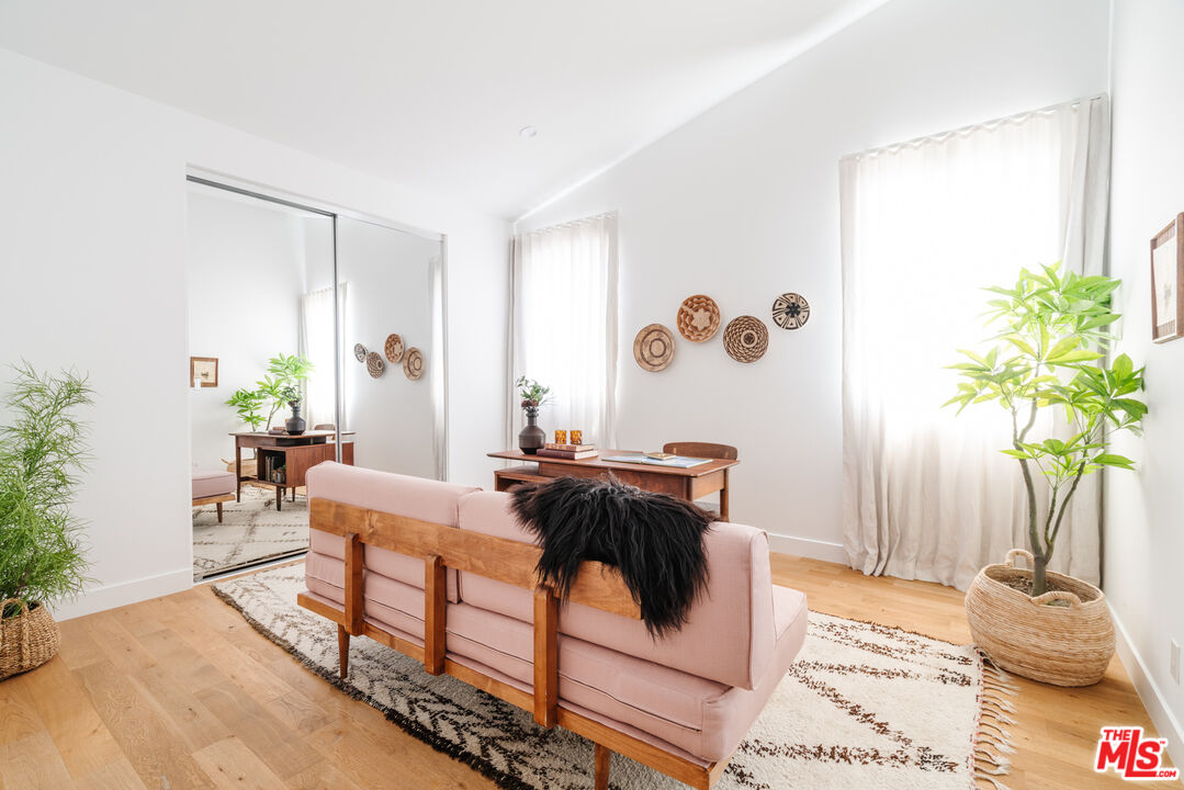 2437 Walnut Avenue Venice, CA 90291 - Photo 22 of 44 a living room with furniture and a potted plant