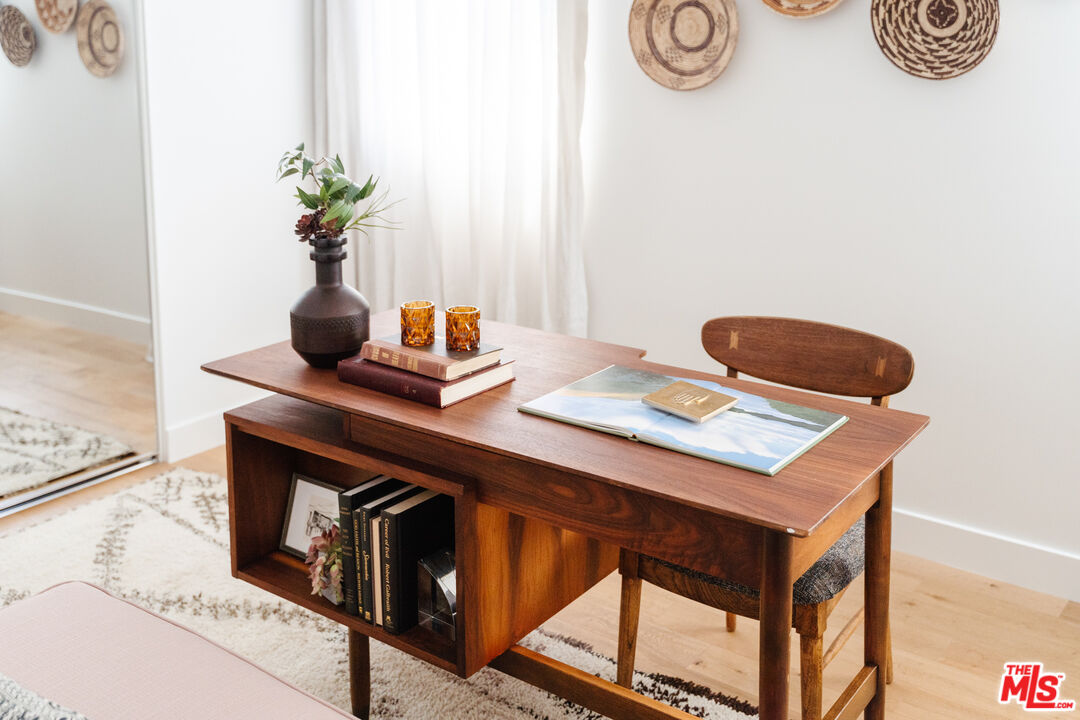 2437 Walnut Avenue Venice, CA 90291 - Photo 23 of 44 a table with a sink and a stove with wooden floor