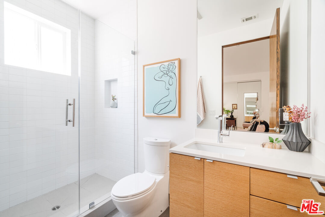 2437 Walnut Avenue Venice, CA 90291 - Photo 24 of 44 a bathroom with a sink a toilet and shower