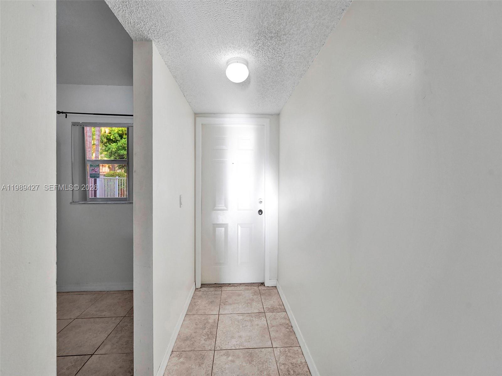4600 Southwest 67th Avenue, Unit 155 Miami, FL 33155 - Photo 22 of 32 a view of an empty room and window