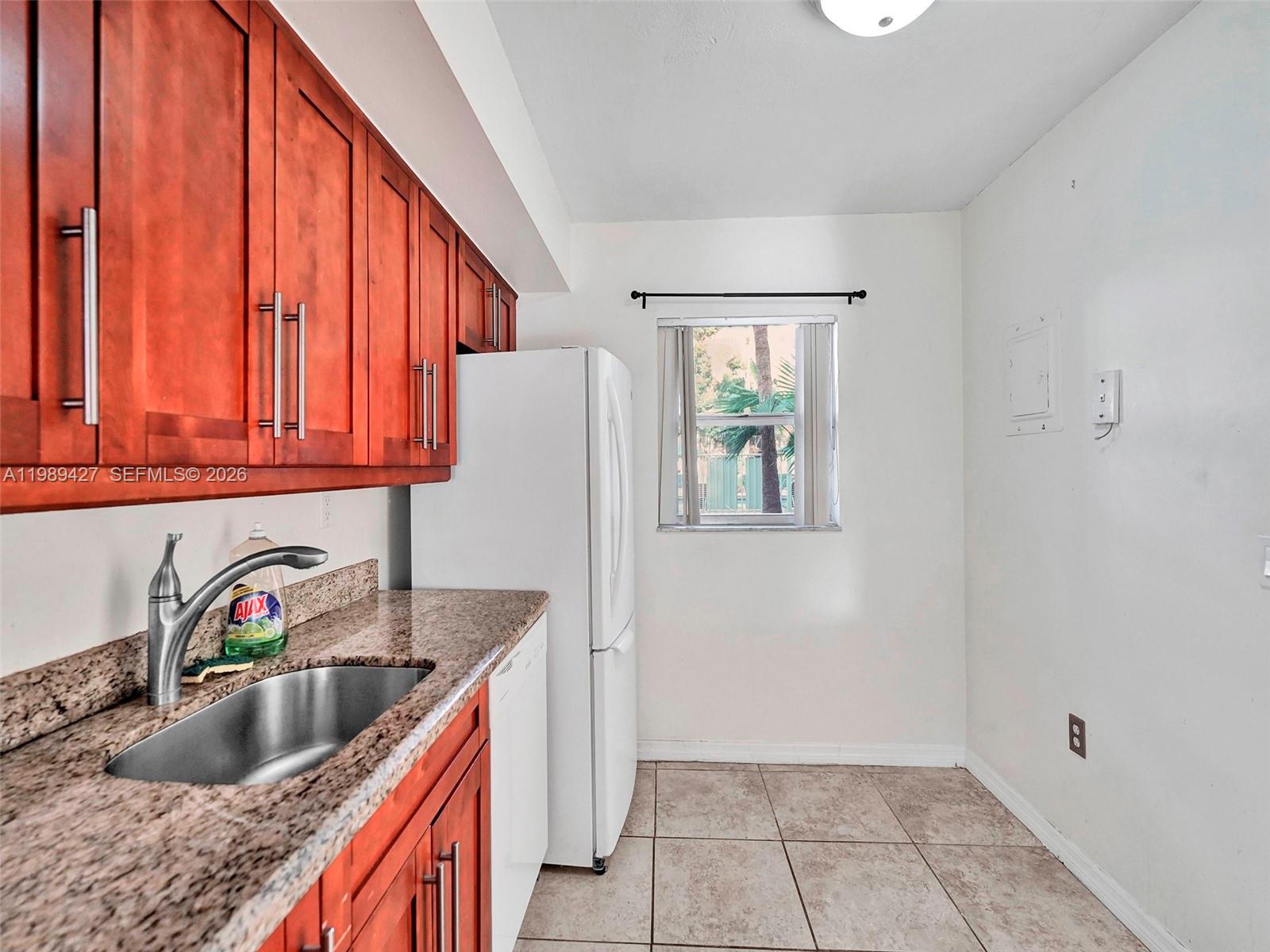 4600 Southwest 67th Avenue, Unit 155 Miami, FL 33155 - Photo 24 of 32 a kitchen with a sink cabinets and window