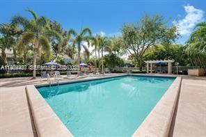 4600 Southwest 67th Avenue, Unit 155 Miami, FL 33155 - Photo 32 of 32 a view of a swimming pool with a patio