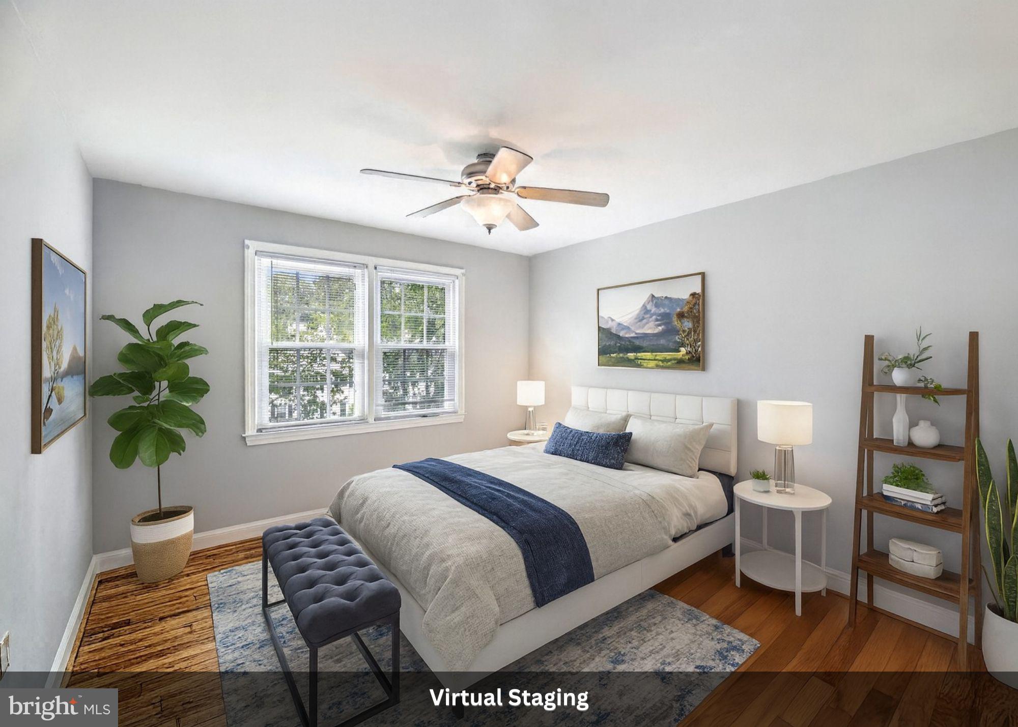 2904 13th Road South, Unit 301 Arlington, VA 22204 - Photo 6 of 13 a bedroom with a bed and a potted plant