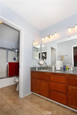 a bedroom with a bed and chair