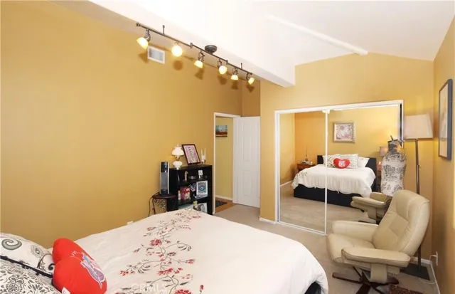 a bedroom with a bed and window