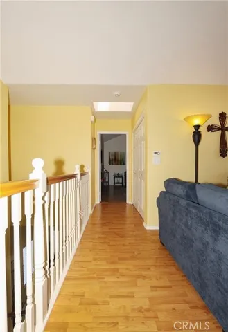 a view of a kitchen from a hallway