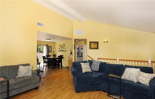 a living room with fireplace furniture and a flat screen tv