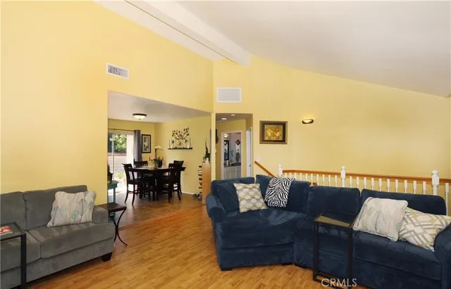 a living room with fireplace furniture and a flat screen tv