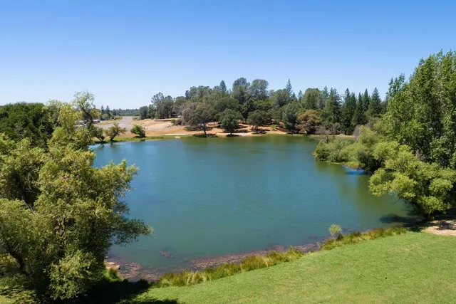 a view of a lake with a yard