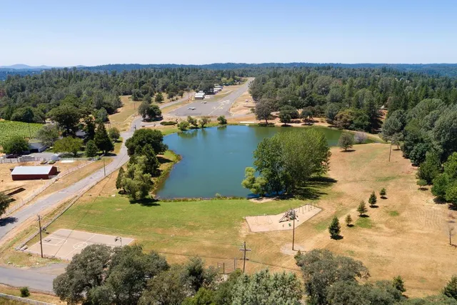 an aerial view of lake residential house with outdoor space