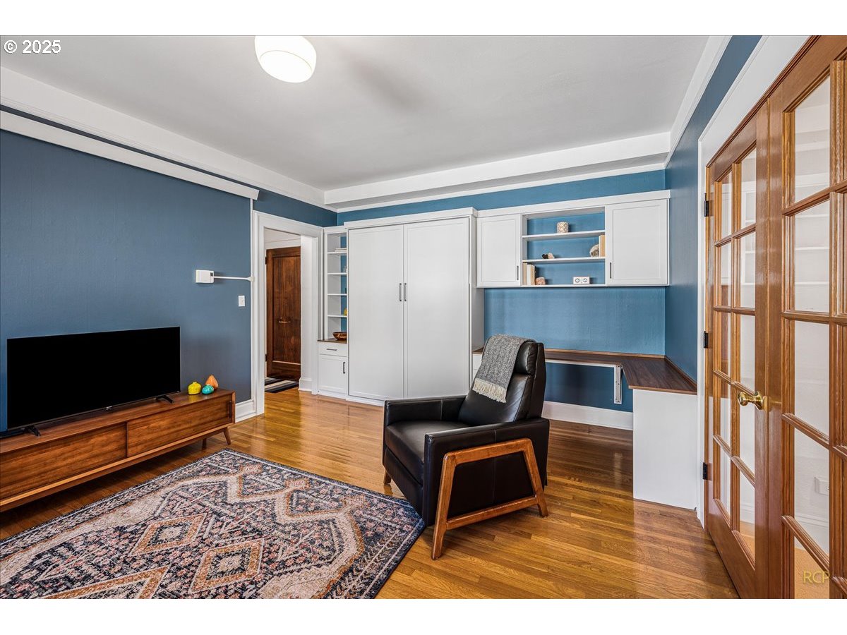 2015 Northwest Flanders Street, Unit 408 Portland, OR 97209 - Photo 12 of 37 a living room with furniture and a flat screen tv