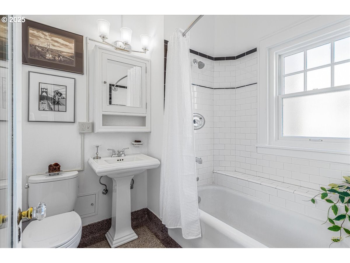2015 Northwest Flanders Street, Unit 408 Portland, OR 97209 - Photo 15 of 37 a bathroom with a sink toilet and shower