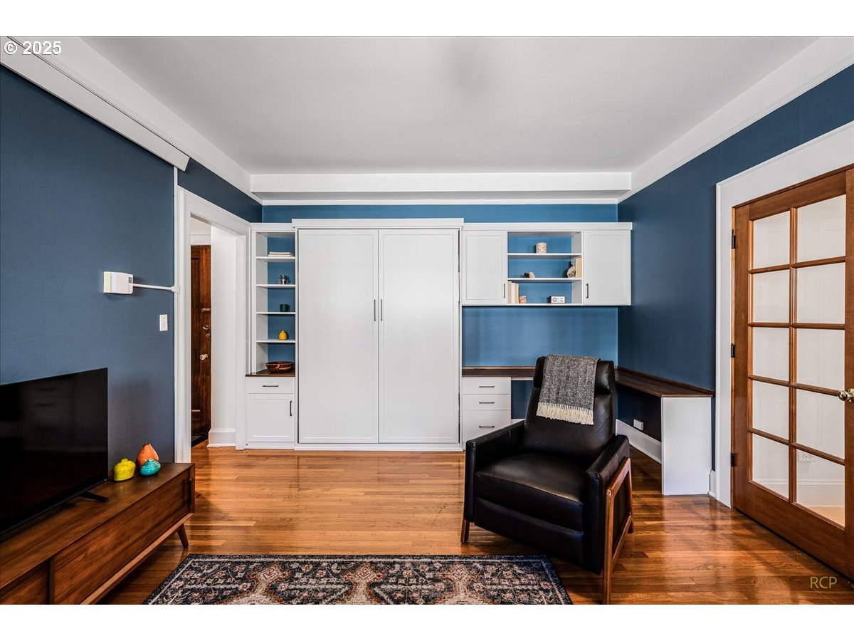 2015 Northwest Flanders Street, Unit 408 Portland, OR 97209 - Photo 2 of 37 a living room with furniture and a flat screen tv