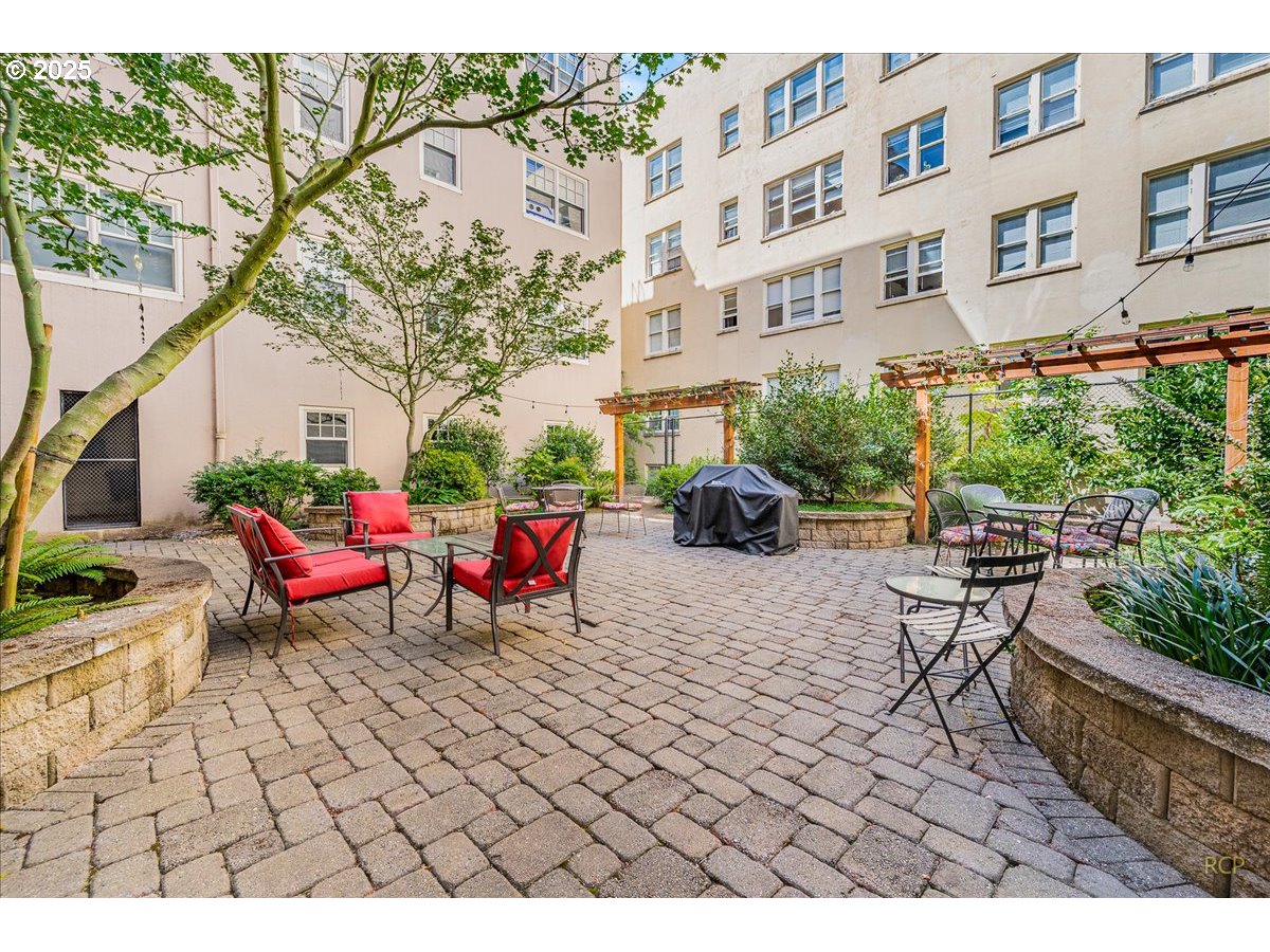 2015 Northwest Flanders Street, Unit 408 Portland, OR 97209 - Photo 24 of 37 a view of a backyard with sitting area
