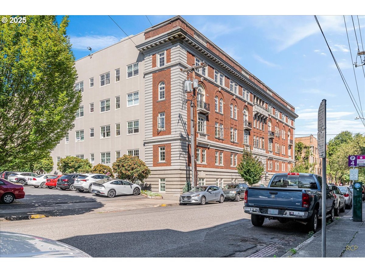 2015 Northwest Flanders Street, Unit 408 Portland, OR 97209 - Photo 32 of 37 a car parked in front of a building