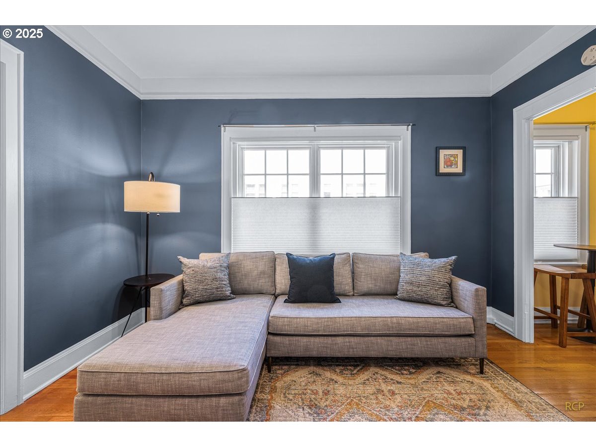 2015 Northwest Flanders Street, Unit 408 Portland, OR 97209 - Photo 4 of 37 a living room with furniture and a window