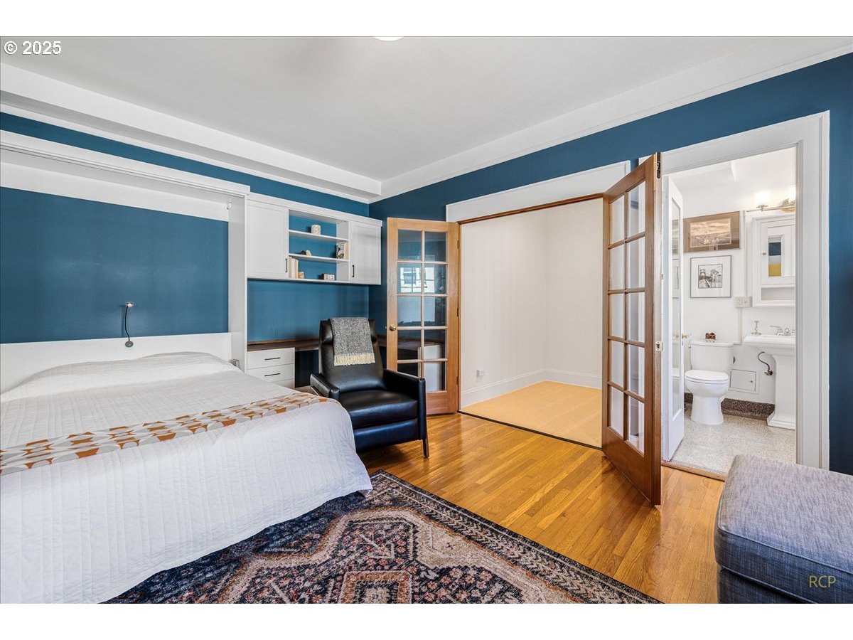 2015 Northwest Flanders Street, Unit 408 Portland, OR 97209 - Photo 10 of 37 a bedroom with a bed and a large window
