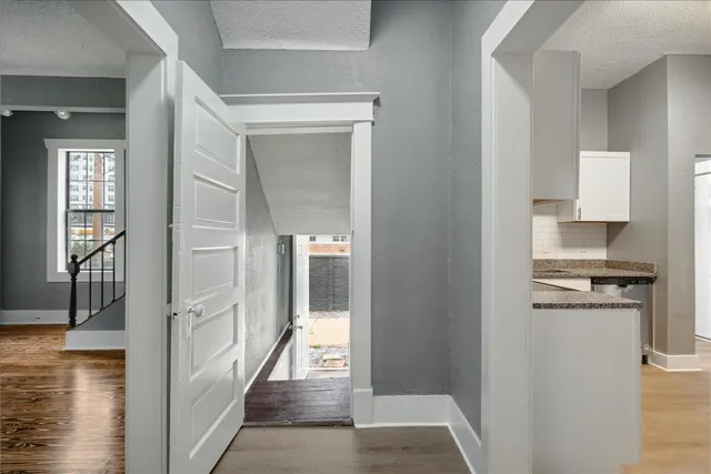 a view of a kitchen from the hallway