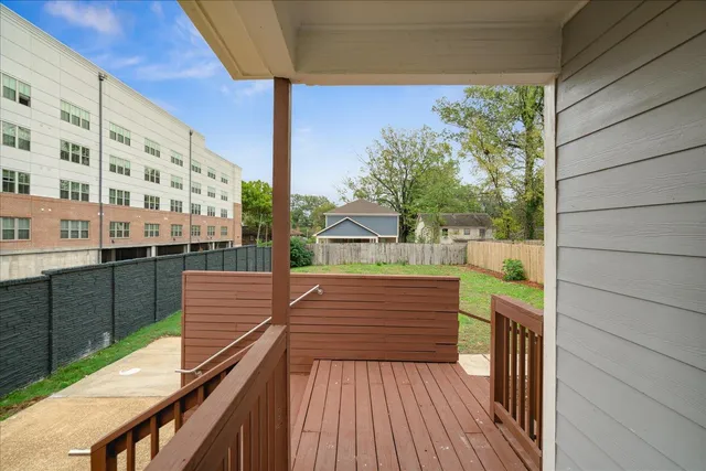 a view of balcony with wooden floor