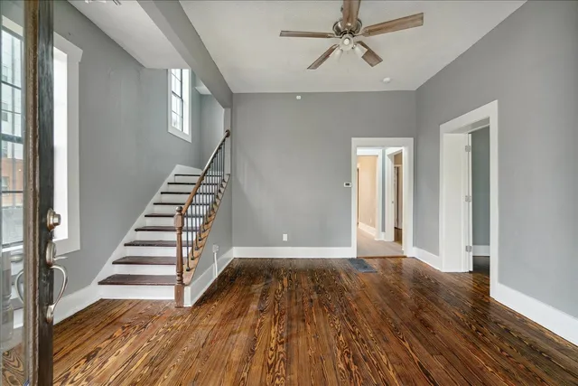 wooden floor in an empty room with a window