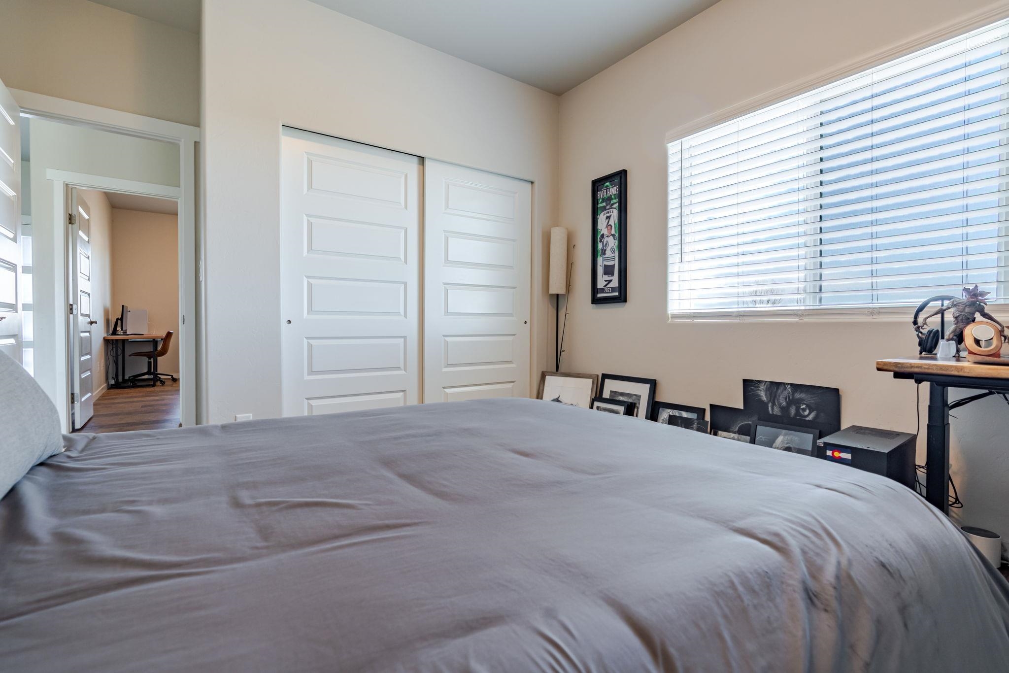 1301 M Road Loma, CO 81524 - Photo 22 of 32 a bedroom with a bed and a chair