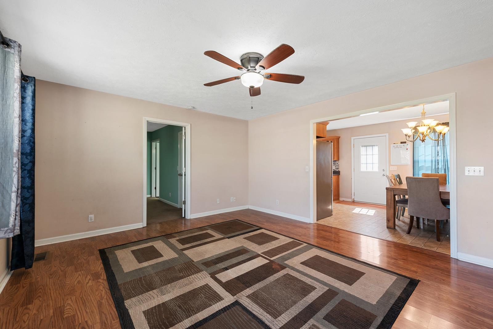 109 Spry Road Morrison, TN 37357 - Photo 5 of 30 a living room with hard wood flooring and a rug