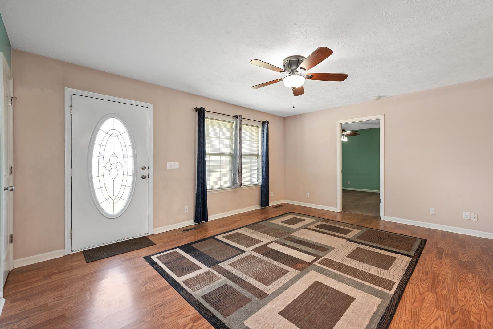 109 Spry Road Morrison, TN 37357 - Photo 6 of 30 a view of an empty room with window and wooden floor