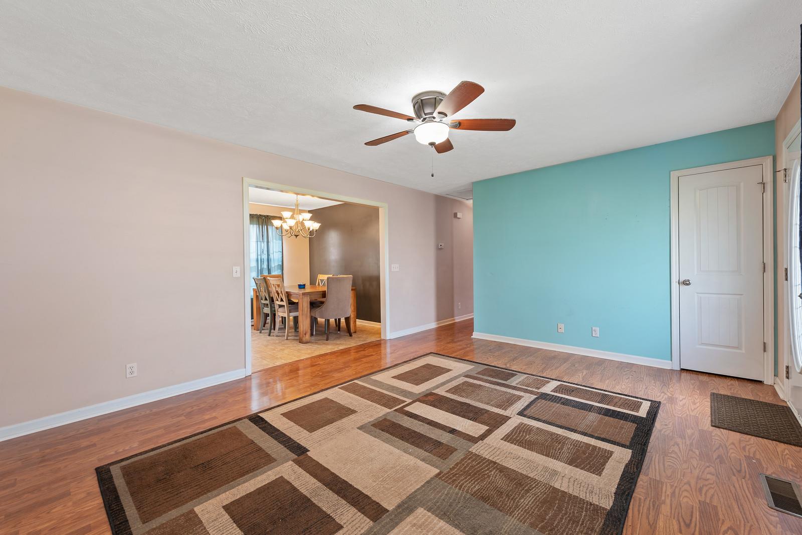 109 Spry Road Morrison, TN 37357 - Photo 8 of 30 a bedroom with a bed and a chandelier