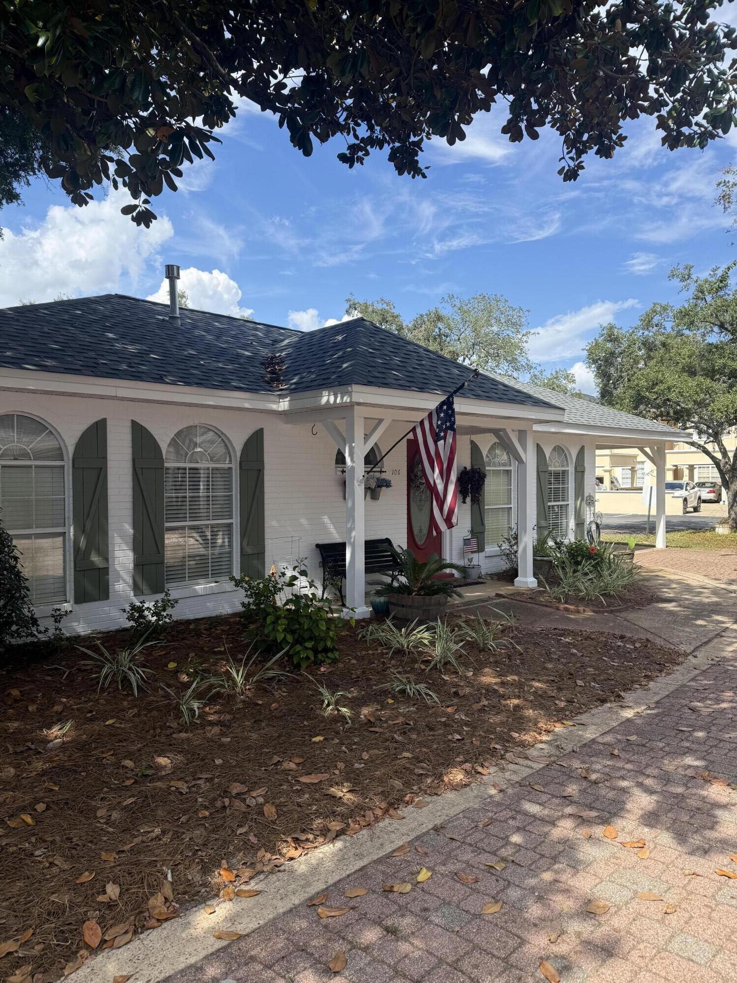 3863 Indian Trail, Unit 106 Destin, FL 32541 - Photo 3 of 22 a view of a barn with a yard