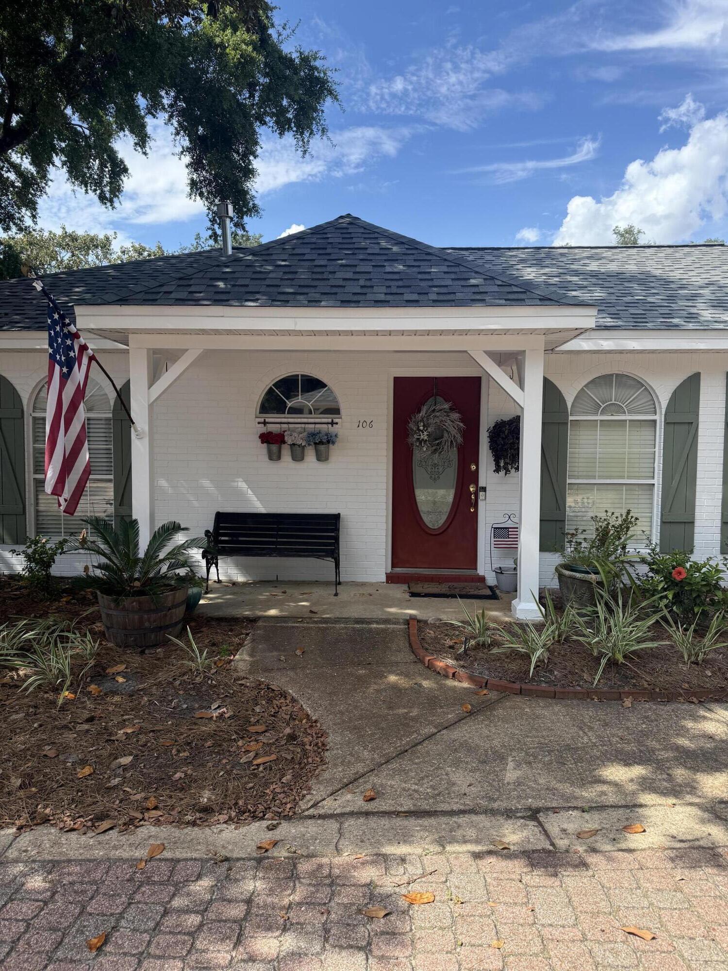 3863 Indian Trail, Unit 106 Destin, FL 32541 - Photo 5 of 22 a front view of house with yard