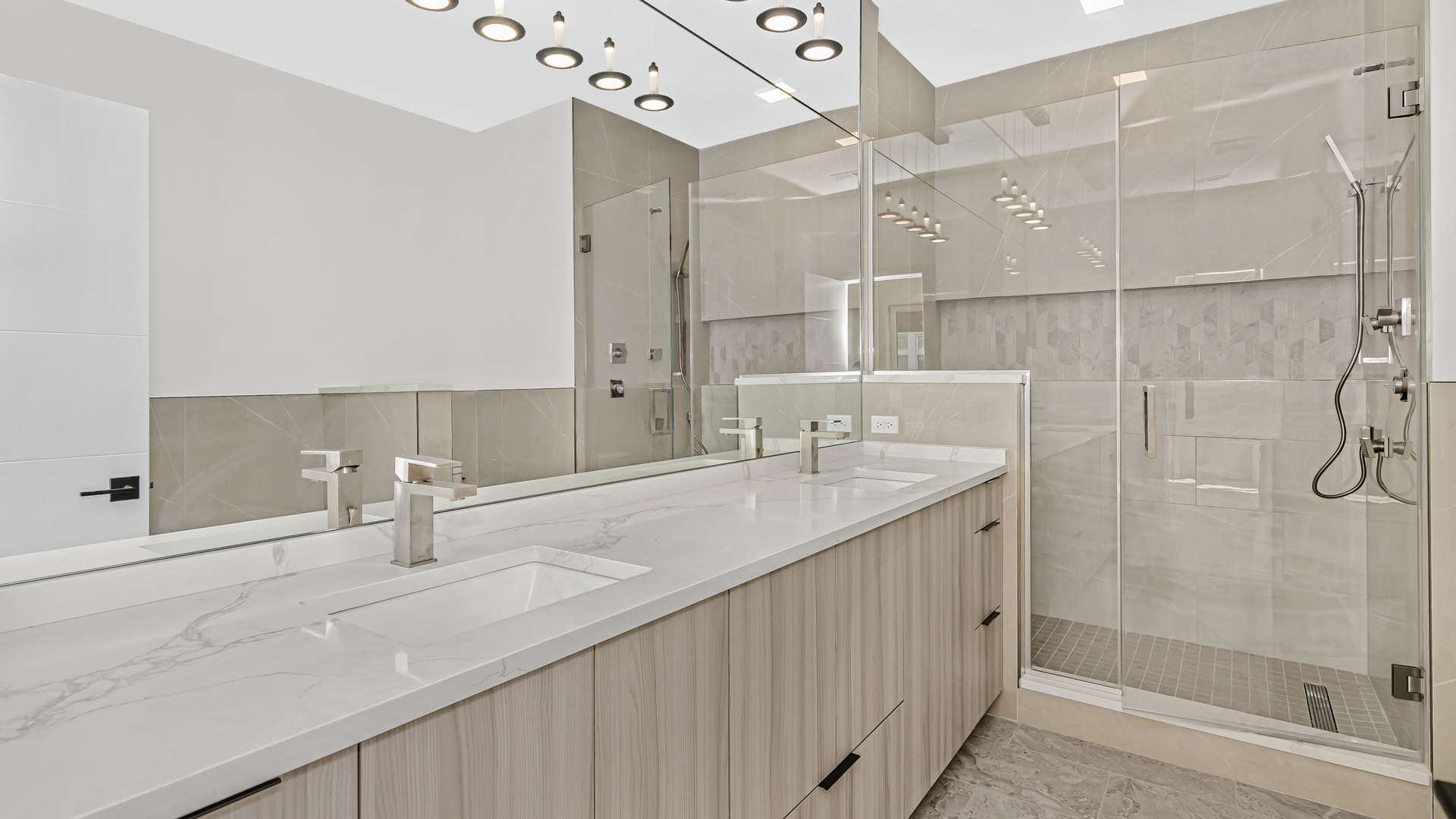 336 East Pershing Road Chicago, IL 60653 - Photo 17 of 44 a bathroom with a double vanity sink mirror and shower