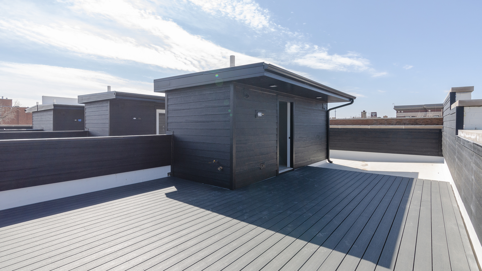 336 East Pershing Road Chicago, IL 60653 - Photo 35 of 44 a view of a balcony with wooden floor and city view
