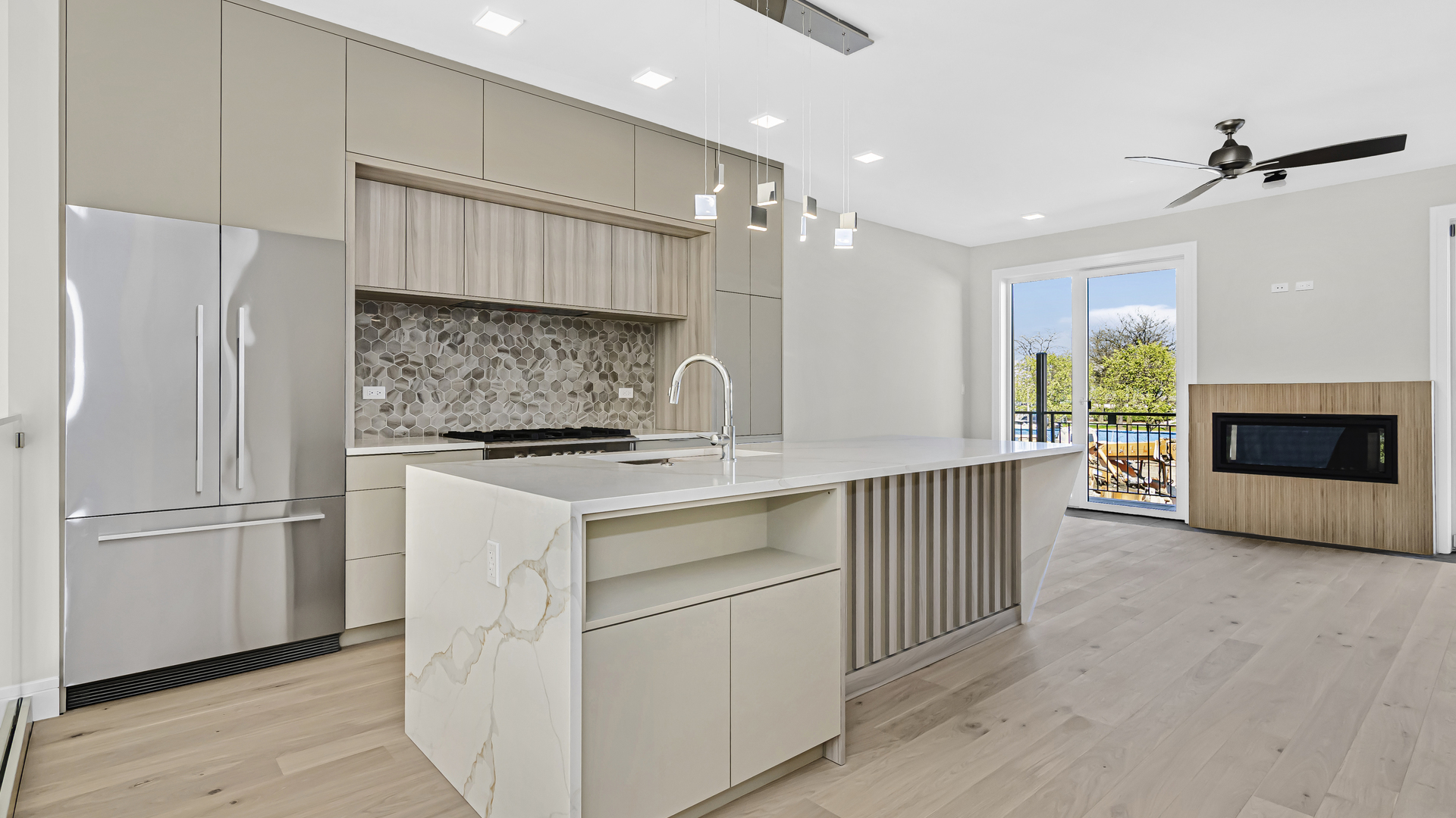 336 East Pershing Road Chicago, IL 60653 - Photo 7 of 44 a kitchen with stainless steel appliances kitchen island granite countertop a refrigerator and a sink