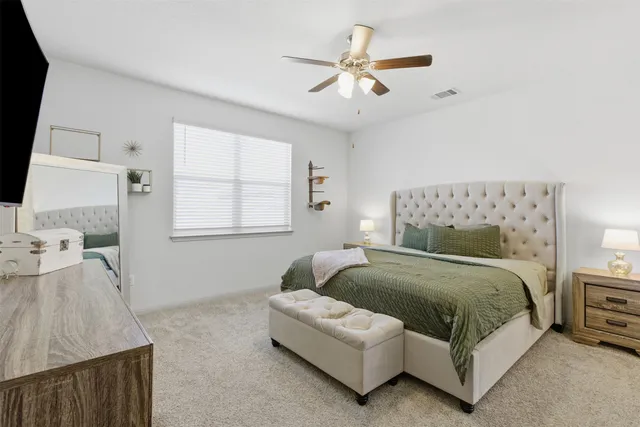 a bedroom with a bed and window