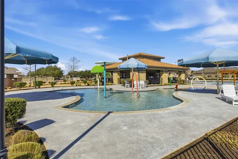 a view of a balcony with chairs