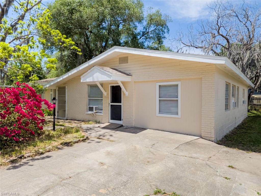 3488 Roberts Street Mims, FL 32754 - Photo 1 of 15 a view of a house with a yard and garage