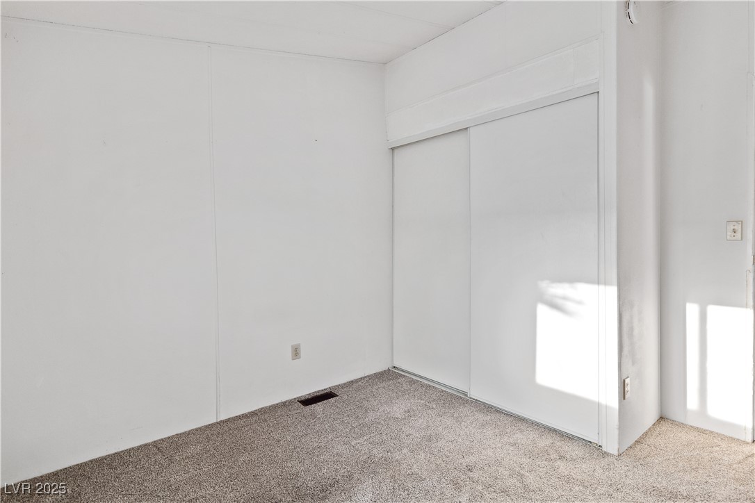 1671 Granada Street Laughlin, NV 89029 - Photo 17 of 63 Unfurnished bedroom with a closet and carpet flooring
