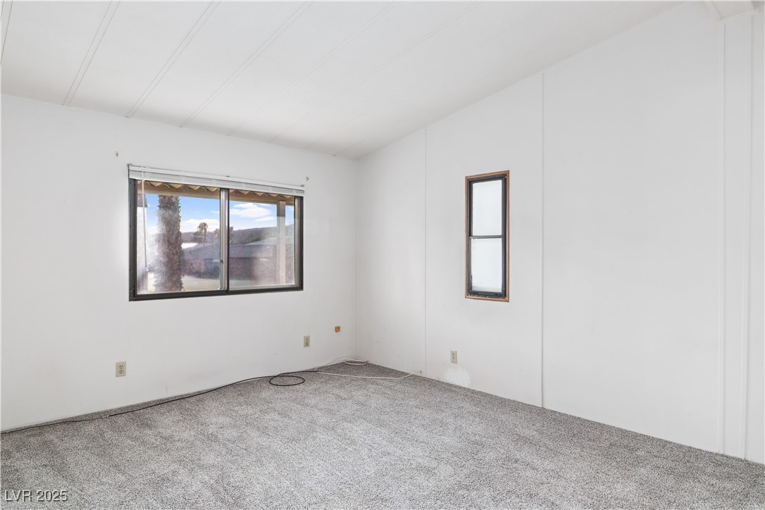 1671 Granada Street Laughlin, NV 89029 - Photo 20 of 63 View of carpeted Primary bedroom