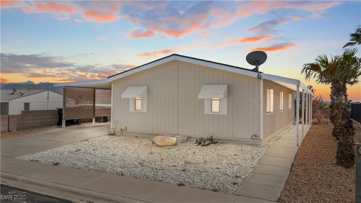 1671 Granada Street Laughlin, NV 89029 - Photo 2 of 63 View of property exterior with concrete driveway and fence