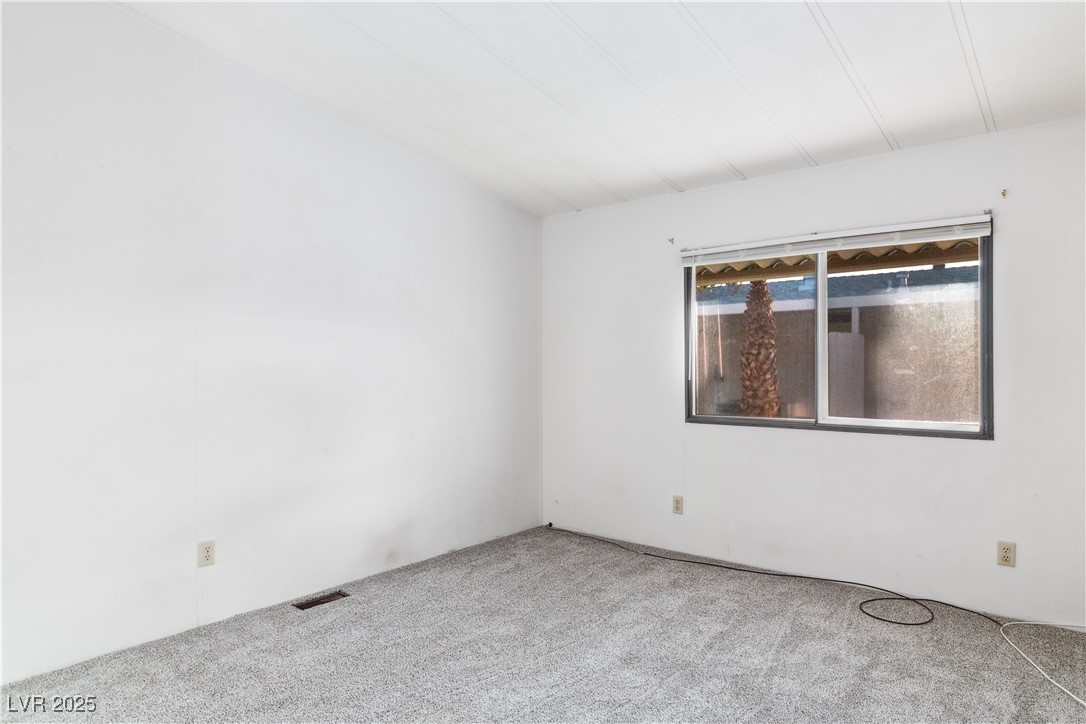 1671 Granada Street Laughlin, NV 89029 - Photo 21 of 63 Primary bedroom featuring carpet floors and visible vents