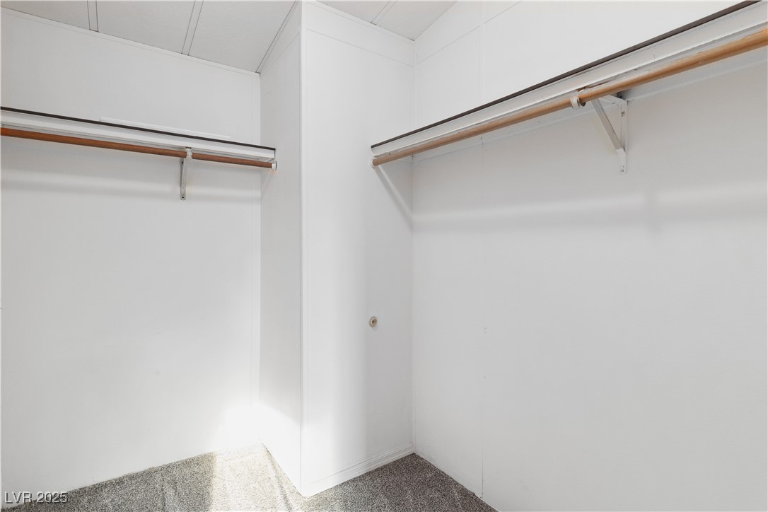 1671 Granada Street Laughlin, NV 89029 - Photo 23 of 63 Spacious walk-in closet with carpet flooring