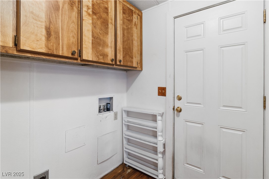 1671 Granada Street Laughlin, NV 89029 - Photo 26 of 63 Washroom featuring cabinet space and washer hookup