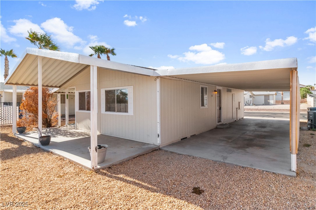 1671 Granada Street Laughlin, NV 89029 - Photo 34 of 63 View of side of property featuring an attached carport