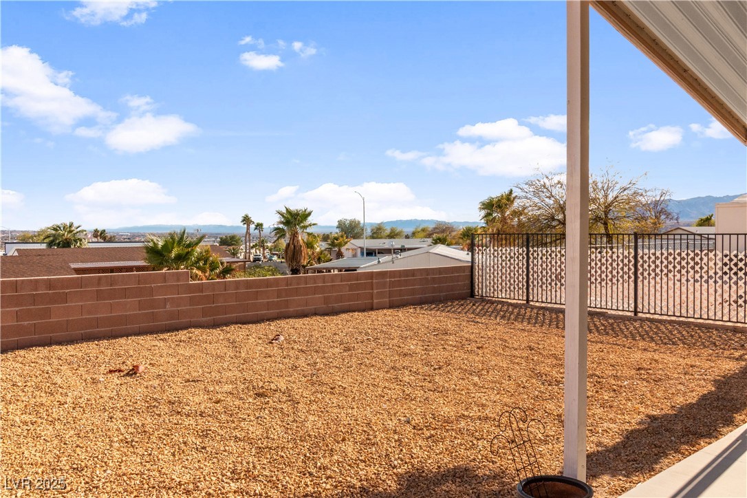 1671 Granada Street Laughlin, NV 89029 - Photo 44 of 63 View of yard featuring a fenced backyard and a mountain view