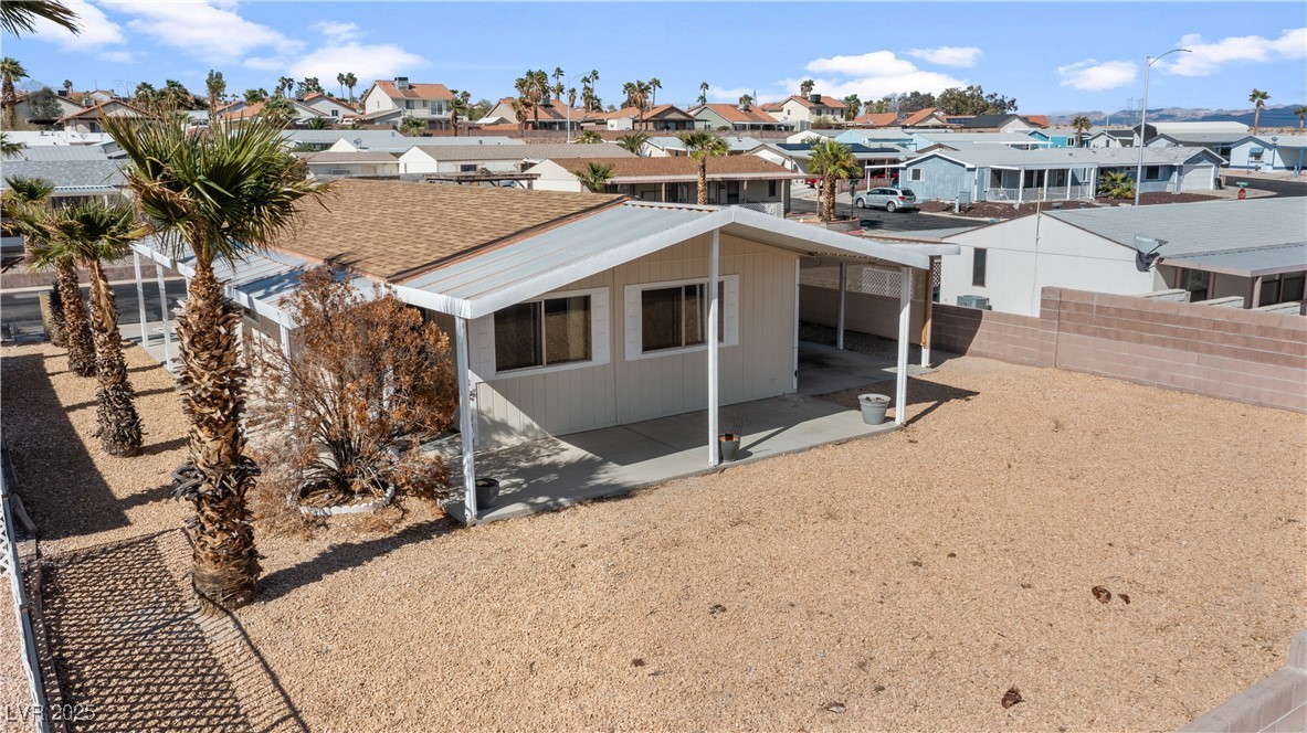 1671 Granada Street Laughlin, NV 89029 - Photo 57 of 63 Rear view of house with fence private yard, and a residential view