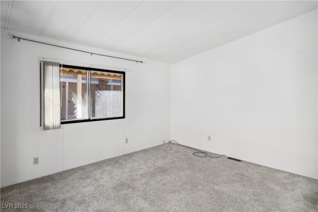 1671 Granada Street Laughlin, NV 89029 - Photo 8 of 63 Living room with carpet
