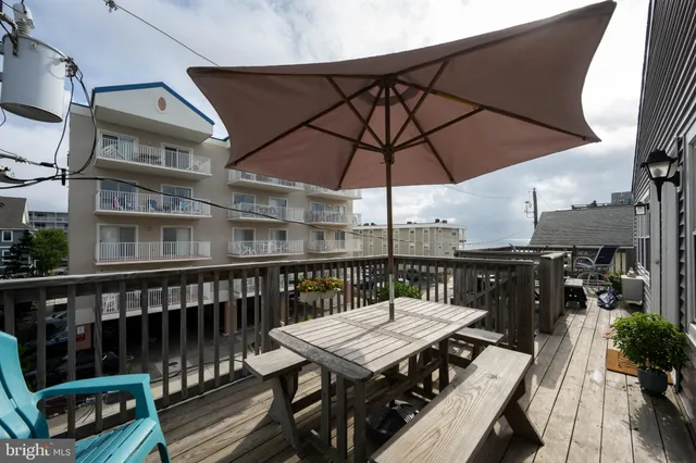 a view of a balcony with furniture