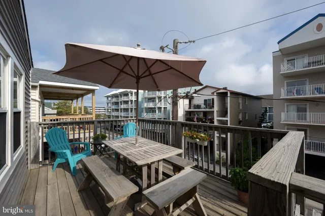 a view of a chairs and table on the deck