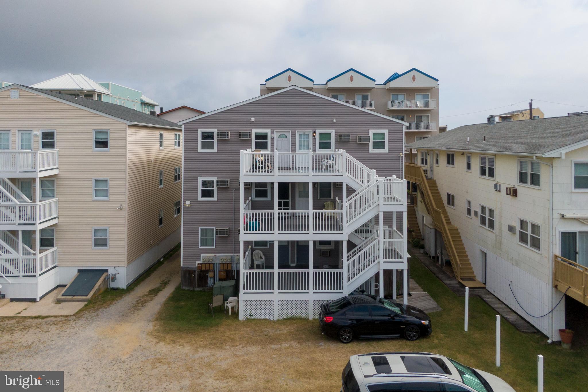 9 79th Street, Unit 3W Ocean City, MD 21842 - Photo 30 of 34 a front view of a house with a parking space